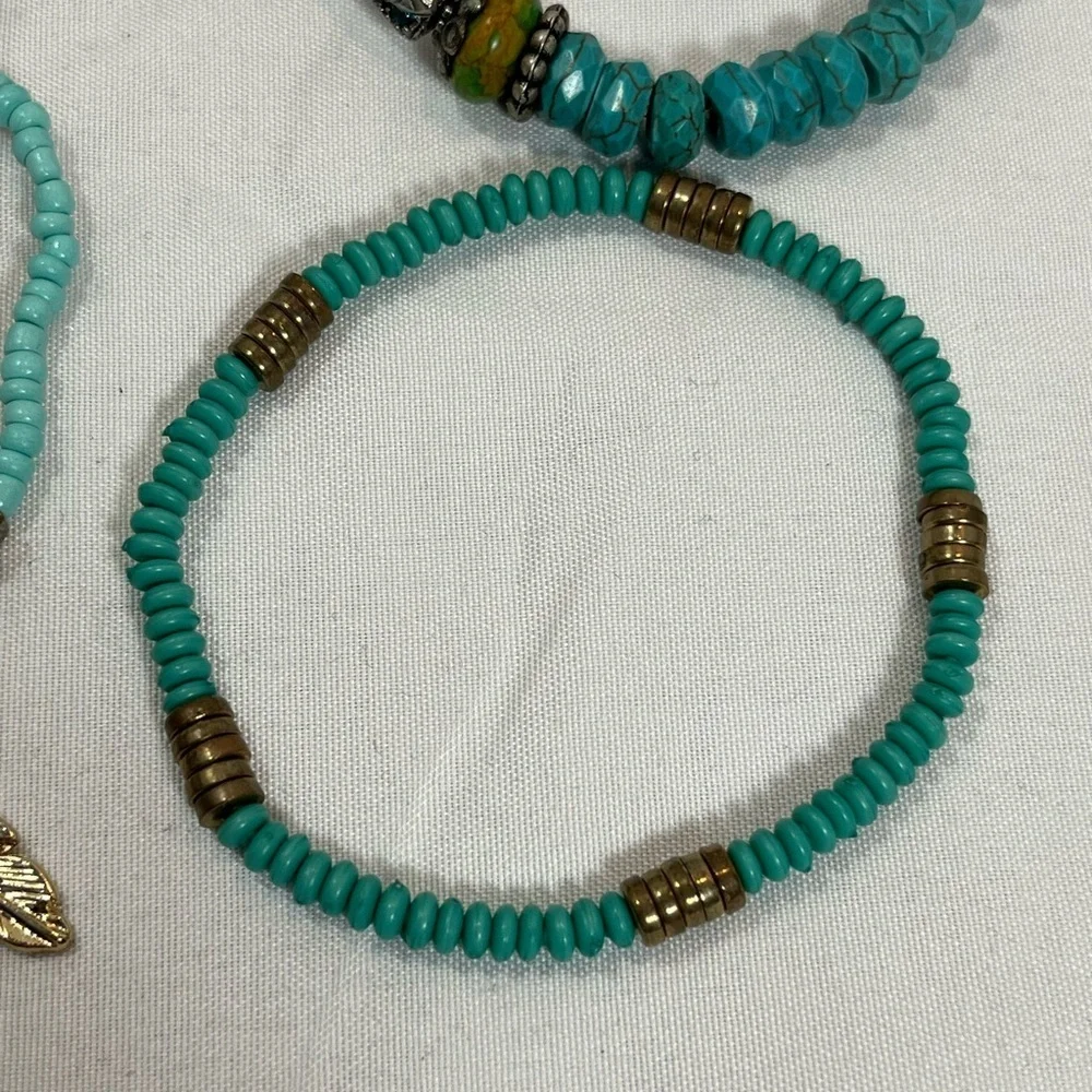 Set of four- turquoise bead bracelets.